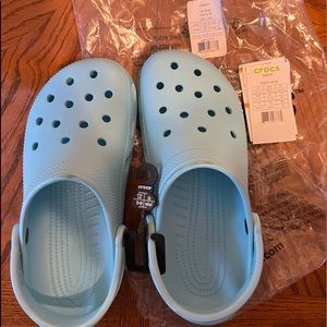 Classic ice blue Crocs, roomy fit.